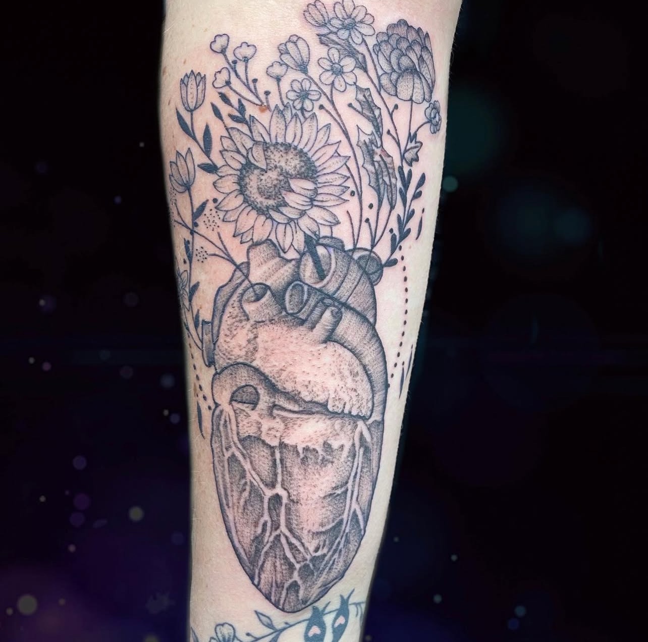 Anatomical heart with sunflowers black and gray tattoo